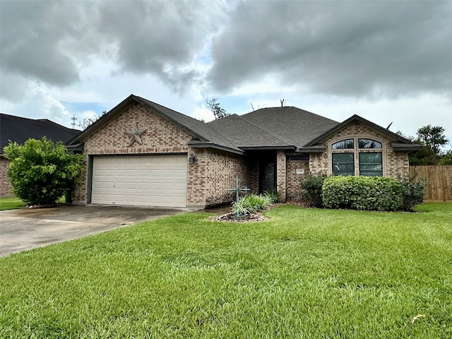 1040 Cardinal Dr, Richwood, TX 77566 - view of front of property featuring brick siding, a garage, driveway, and roof with shingles