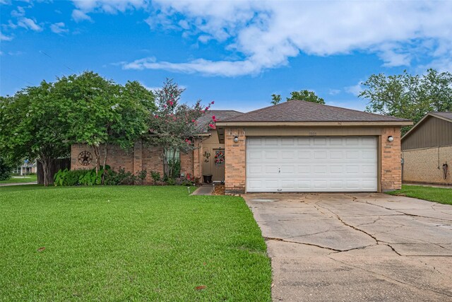 1805 Willow Bend Rd, Wharton, TX 77488 - ranch-style home with brick siding, driveway, a front yard, and an attached garage