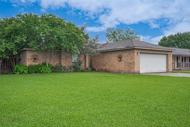 1805 Willow Bend Rd, Wharton, TX 77488 - view of front of property featuring an attached garage, brick siding, a front lawn, and driveway