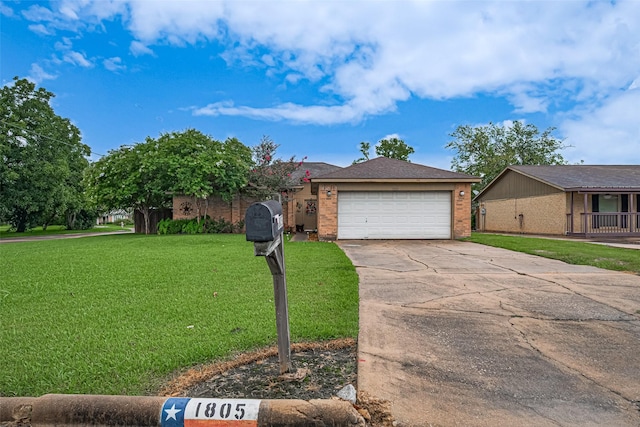 1805 Willow Bend Rd, Wharton, TX 77488 - view of front of property with driveway, a front lawn, a garage, and brick siding