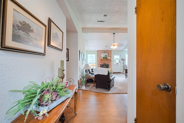 1805 Willow Bend Rd, Wharton, TX 77488 - corridor featuring a textured ceiling and light wood-style flooring