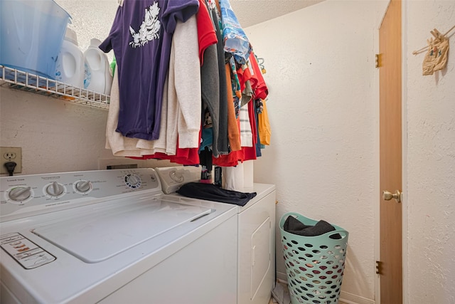1805 Willow Bend Rd, Wharton, TX 77488 - washroom with washing machine and dryer and a textured wall