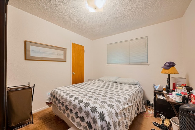 1805 Willow Bend Rd, Wharton, TX 77488 - carpeted bedroom with a textured ceiling and baseboards