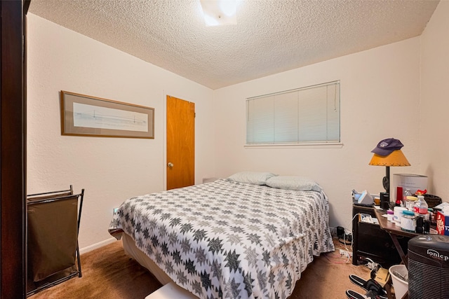1805 Willow Bend Rd, Wharton, TX 77488 - carpeted bedroom with a textured ceiling and baseboards