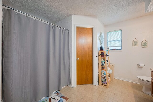 1805 Willow Bend Rd, Wharton, TX 77488 - full bathroom with a textured ceiling, tile patterned floors, and curtained shower