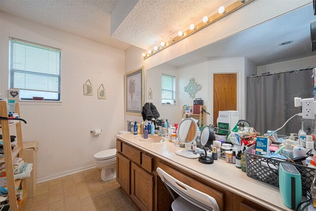 1805 Willow Bend Rd, Wharton, TX 77488 - bathroom featuring vanity, a textured ceiling, and curtained shower