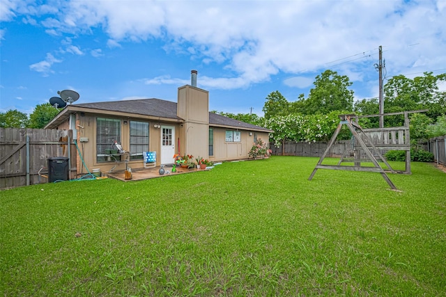 1805 Willow Bend Rd, Wharton, TX 77488 - fenced backyard with a playground and a patio area