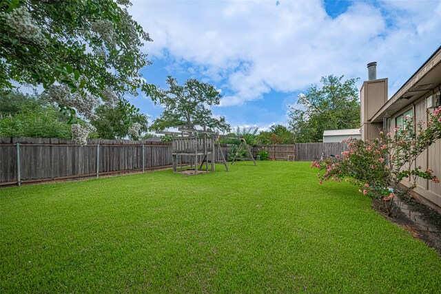 1805 Willow Bend Rd, Wharton, TX 77488 - fenced backyard with a playground