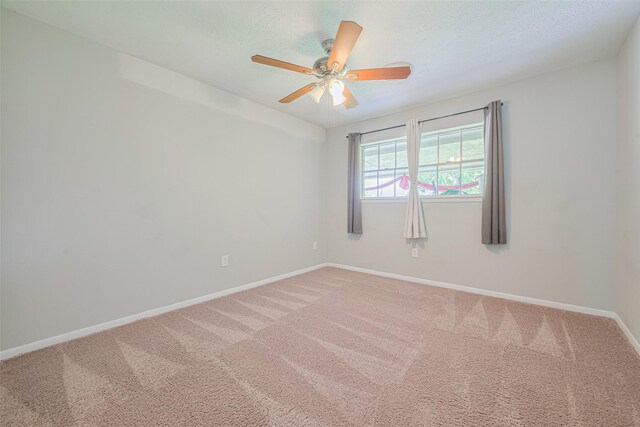 101 Wildrose St, Baytown, TX 77520 - carpeted empty room featuring a ceiling fan and a textured ceiling