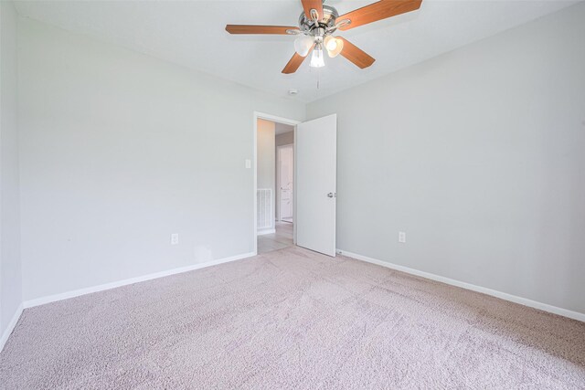 101 Wildrose St, Baytown, TX 77520 - empty room with light colored carpet and ceiling fan