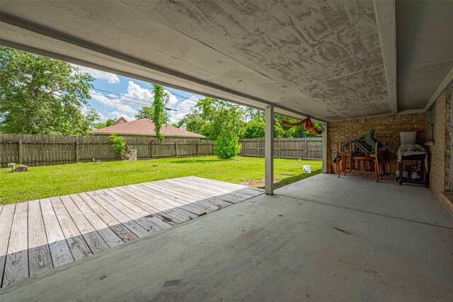 101 Wildrose St, Baytown, TX 77520 - fenced backyard featuring a patio and a wooden deck