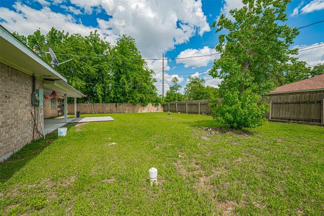 101 Wildrose St, Baytown, TX 77520 - fenced backyard with a patio