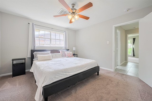 101 Wildrose St, Baytown, TX 77520 - tiled bedroom with carpet and ceiling fan