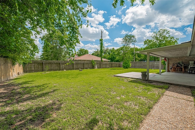 101 Wildrose St, Baytown, TX 77520 - fenced backyard with a patio area