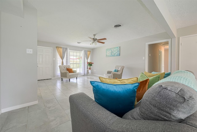 101 Wildrose St, Baytown, TX 77520 - living room with ceiling fan, a textured ceiling, and light tile patterned floors