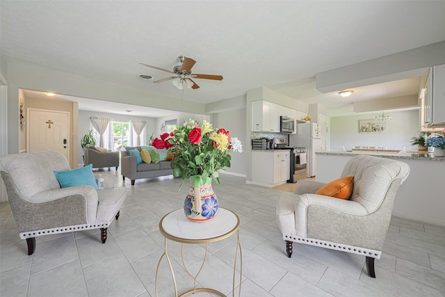 101 Wildrose St, Baytown, TX 77520 - living area featuring ceiling fan and light tile patterned floors