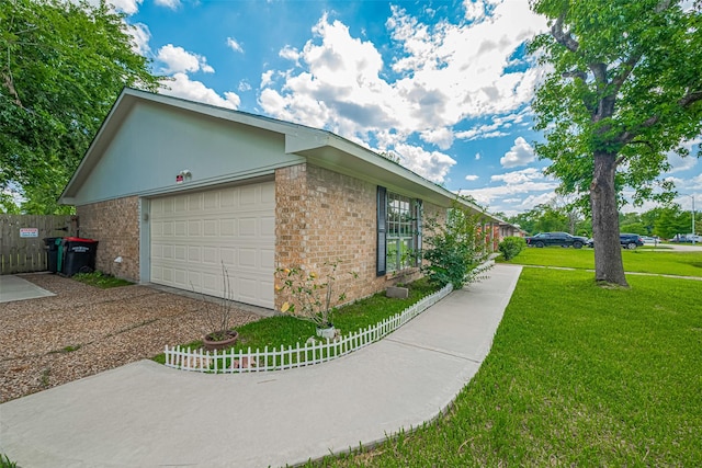 101 Wildrose St, Baytown, TX 77520 - view of home's exterior with brick siding, driveway, and a garage