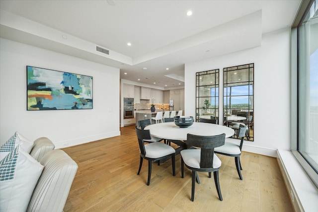5656 San Felipe St Unit 606, Houston, TX 77056 - dining space with recessed lighting and light wood-style flooring