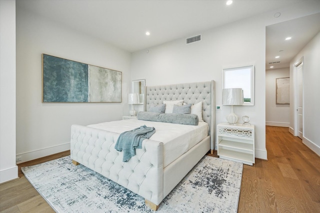 5656 San Felipe St Unit 606, Houston, TX 77056 - bedroom with wood finished floors and recessed lighting