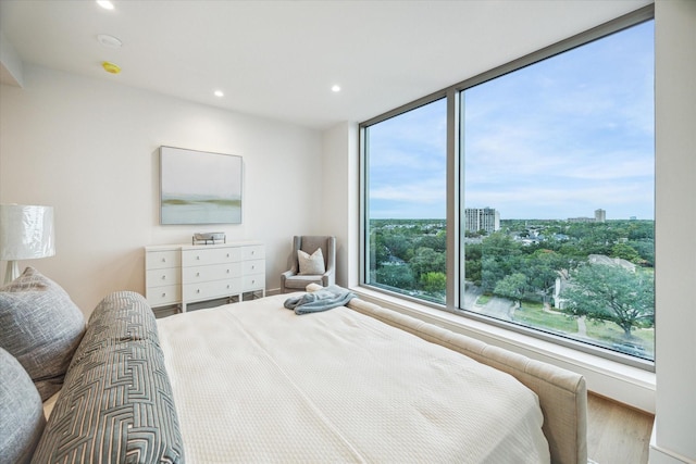 5656 San Felipe St Unit 606, Houston, TX 77056 - bedroom featuring wood finished floors and recessed lighting