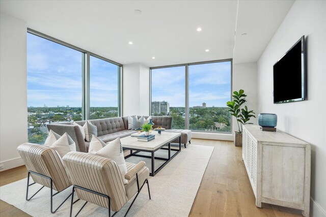 5656 San Felipe St Unit 606, Houston, TX 77056 - living area with light wood-style floors, expansive windows, recessed lighting, and a view of city