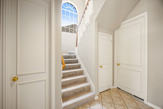4607 Wellbrook Ln, Katy, TX 77450 - staircase featuring tile patterned flooring and lofted ceiling