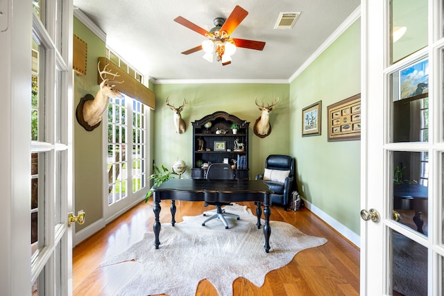 4607 Wellbrook Ln, Katy, TX 77450 - home office with crown molding, wood finished floors, ceiling fan, and french doors