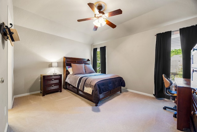 4607 Wellbrook Ln, Katy, TX 77450 - bedroom with light colored carpet, multiple windows, ceiling fan, and vaulted ceiling