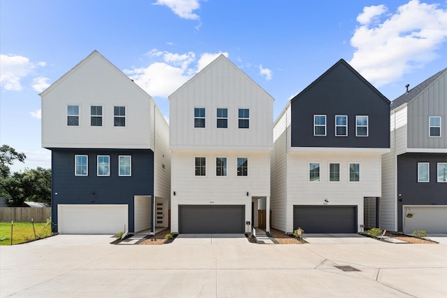 8319 Springwood Canyon Ln, Houston, TX 77055 - view of front of home with a garage, driveway, and board and batten siding