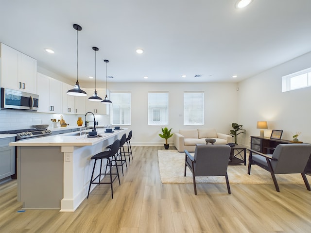 8319 Springwood Canyon Ln, Houston, TX 77055 - living area with light wood-type flooring and recessed lighting