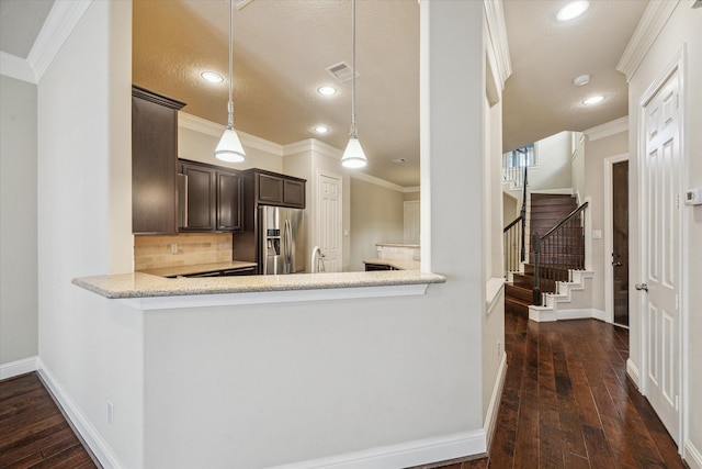5708 Petty St Unit B, Houston, TX 77007 - kitchen featuring stainless steel fridge, dark brown cabinets, crown molding, backsplash, and dark wood-style floors