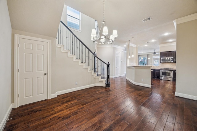 5708 Petty St Unit B, Houston, TX 77007 - kitchen with stainless steel appliances, light countertops, healthy amount of natural light, a chandelier, and crown molding
