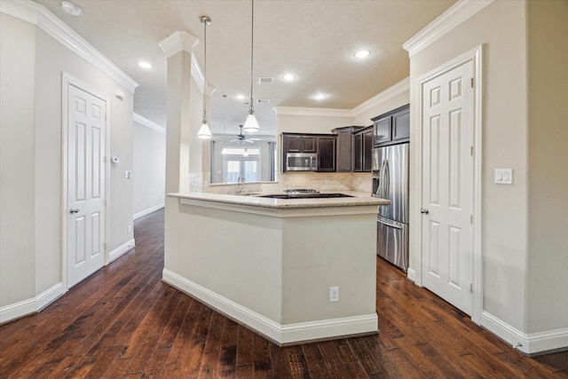 5708 Petty St Unit B, Houston, TX 77007 - kitchen with appliances with stainless steel finishes, crown molding, tasteful backsplash, recessed lighting, and dark wood-style flooring