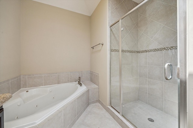 5708 Petty St Unit B, Houston, TX 77007 - bathroom with a tub with jets, a stall shower, and tile patterned flooring