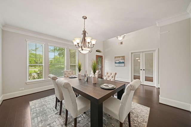 12102 N Founders Shore Dr, Cypress, TX 77433 - dining space featuring a chandelier, french doors, dark wood-type flooring, and ornamental molding