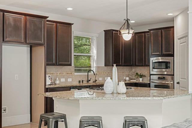12102 N Founders Shore Dr, Cypress, TX 77433 - kitchen featuring appliances with stainless steel finishes, dark brown cabinets, decorative backsplash, and recessed lighting