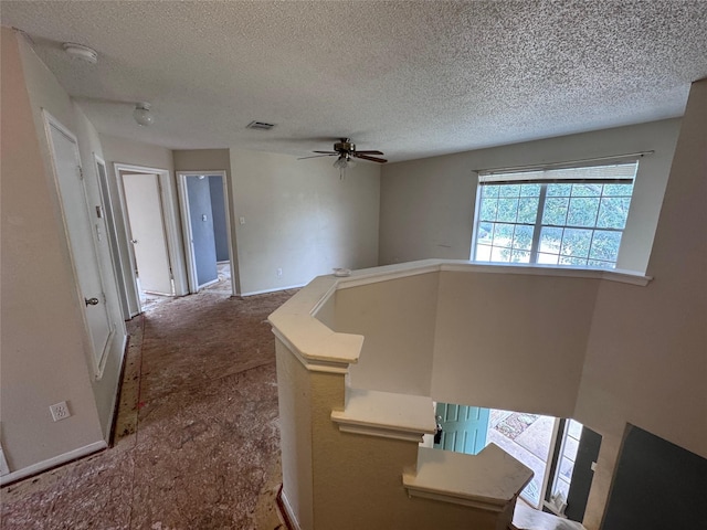 1629 Sylvia Ct, Round Rock, TX 78681 - corridor with a textured ceiling, an upstairs landing, and carpet floors