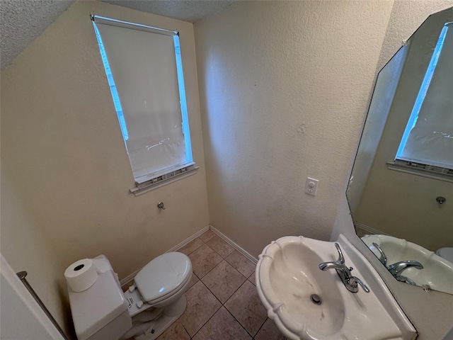1629 Sylvia Ct, Round Rock, TX 78681 - half bathroom with tile patterned flooring and a textured ceiling