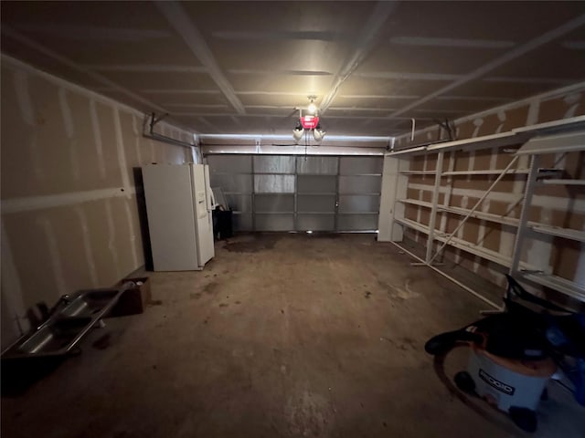 1629 Sylvia Ct, Round Rock, TX 78681 - garage featuring white refrigerator with ice dispenser and a garage door opener