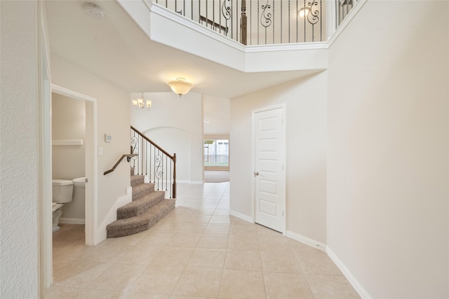15315 Skyhill Dr, Cypress, TX 77433 - entrance foyer with light tile patterned floors, a chandelier, stairs, and a high ceiling