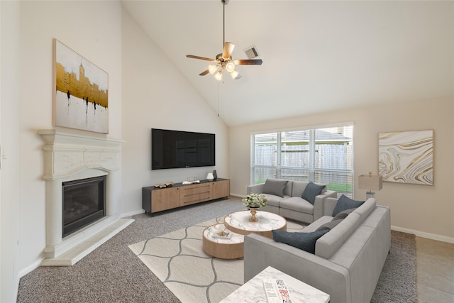 15315 Skyhill Dr, Cypress, TX 77433 - living room featuring a glass covered fireplace, ceiling fan, high vaulted ceiling, and light carpet