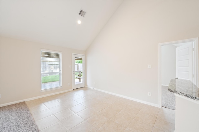 15315 Skyhill Dr, Cypress, TX 77433 - empty room featuring high vaulted ceiling, light tile patterned flooring, and recessed lighting