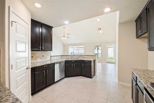 15315 Skyhill Dr, Cypress, TX 77433 - kitchen with stainless steel dishwasher, ceiling fan, light stone countertops, a peninsula, and tasteful backsplash