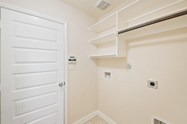 15315 Skyhill Dr, Cypress, TX 77433 - laundry room featuring hookup for an electric dryer, hookup for a washing machine, gas dryer hookup, and light tile patterned floors