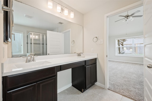 15315 Skyhill Dr, Cypress, TX 77433 - bathroom featuring double vanity, a shower stall, a ceiling fan, and tile patterned floors