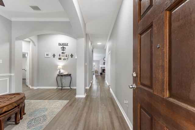 38318 E Sulphur Creek Dr, Magnolia, TX 77355 - hall with wood finished floors, arched walkways, and crown molding