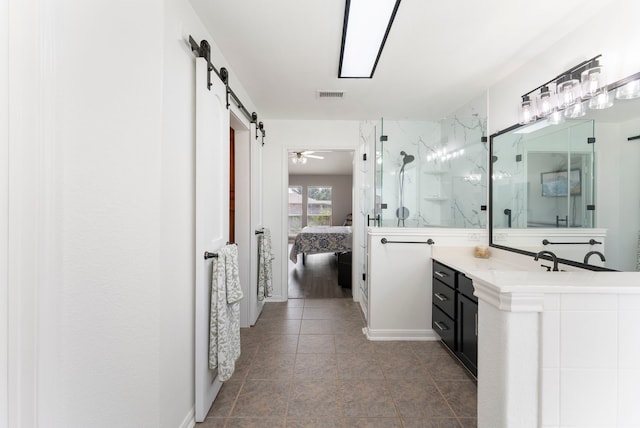 38318 E Sulphur Creek Dr, Magnolia, TX 77355 - ensuite bathroom with a marble finish shower, vanity, and tile patterned flooring