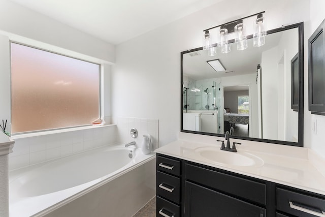 38318 E Sulphur Creek Dr, Magnolia, TX 77355 - bathroom with a bath, vanity, ensuite bathroom, and an enclosed shower