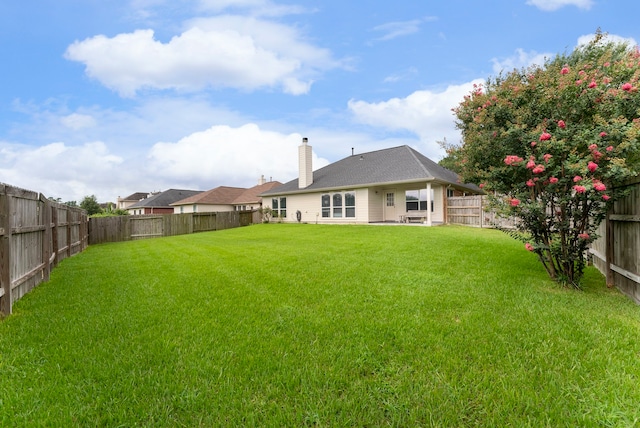 38318 E Sulphur Creek Dr, Magnolia, TX 77355 - back of house featuring a chimney and a fenced backyard