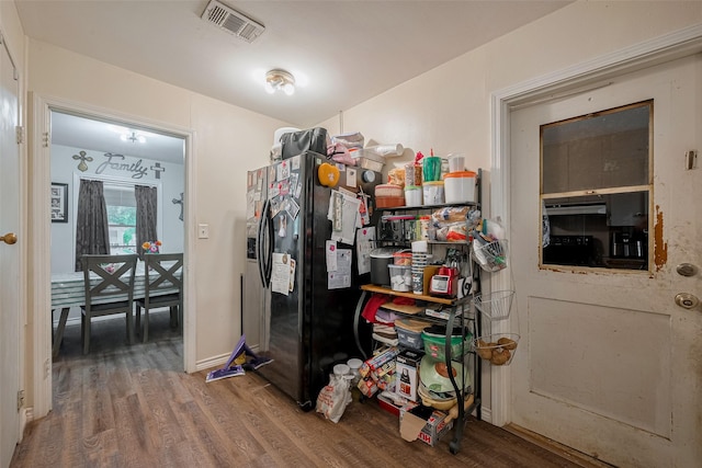 513 Frankie St, Wharton, TX 77488 - kitchen with wood finished floors and black refrigerator with ice dispenser